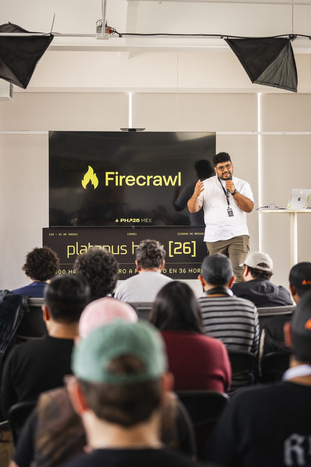 Mid-gesture during the Firecrawl talk